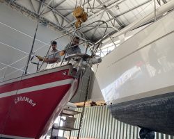 Fifty years old wooden bowsprit is removed